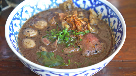 thai boat noodles with wagyu - thai noodle with beef in blood soup