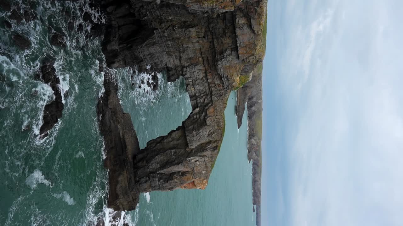Dramatic Coastal Cliffs and Ocean Waves