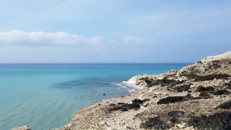 white rocks line the coast of pissouri, limassol, where the deep blue sea meets bright skies. this stunning coastal view captures the raw beauty of cyprus’s mediterranean shoreline.