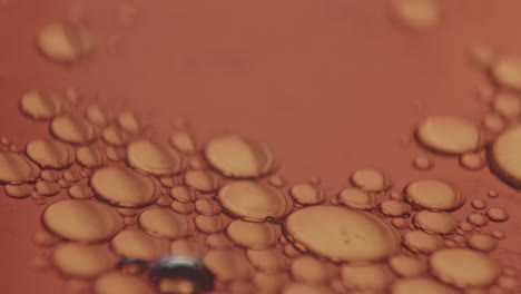 microscopic air bubbles moving clockwise in a viscous liquid