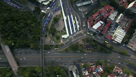 aerial view establishing of the chapultepec subway station in mexico city, central station with a lot of car movement