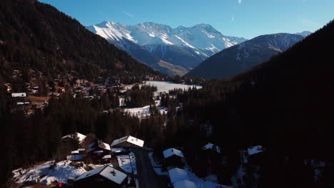 Flight-along-the-high-altitude-winter-valley-at-Orsières,-champe,-switzerland