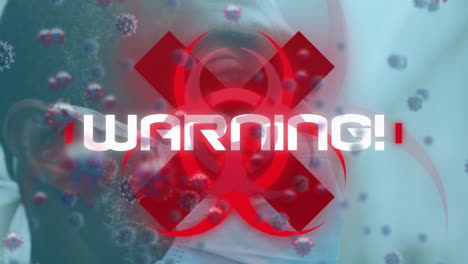 animation of warning text and virus cells over man wearing face mask