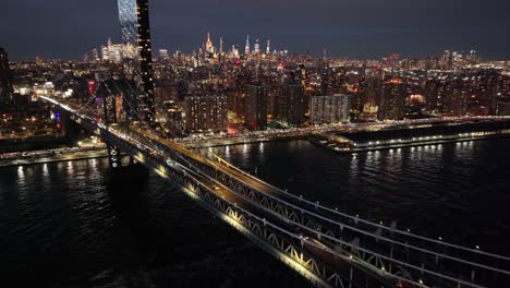 night scape of manhattan bridge at brooklyn in new york united states. city at night scene. illuminated bridge landscape. manhattan bridge at new york united states. highrise buildings.