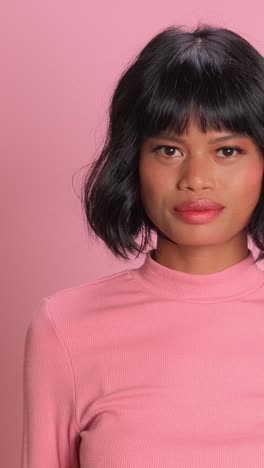 empowering expression in vibrant pink against a playful backdrop