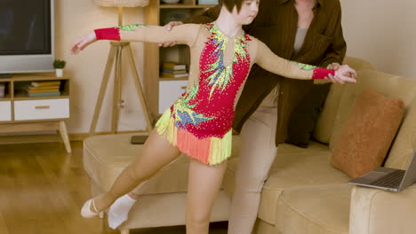 mother teaching her daughter to pose in colorful outfit