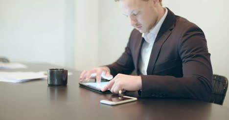 young man using tablet