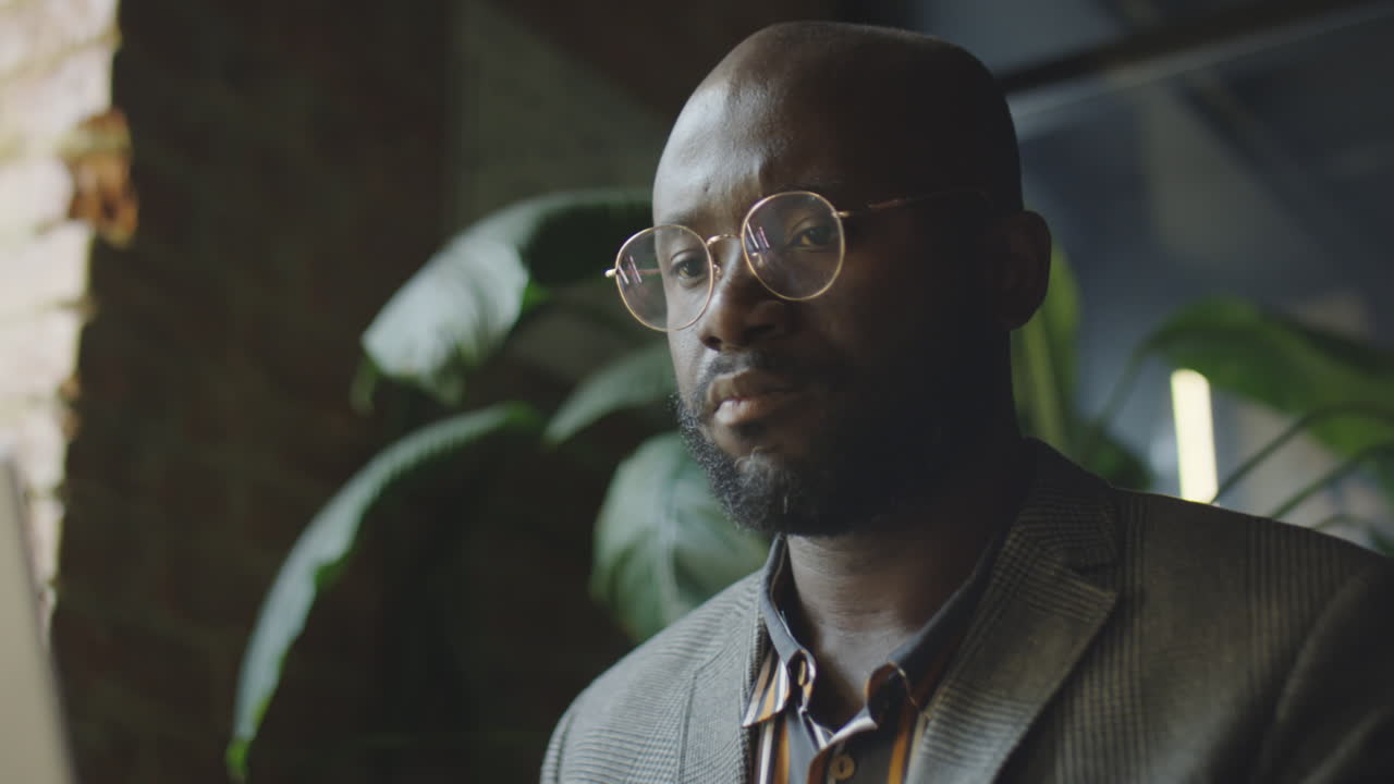 African American Businessman Working in Cafe