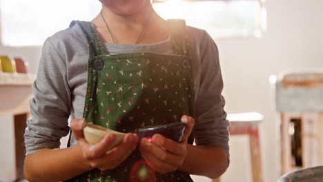 Portrait-of-girl-holding-bowls