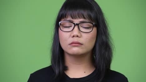 beautiful asian businesswoman relaxing with eyes closed