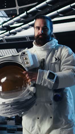 vertical video joyous astronaut greeting command center researchers during videocall