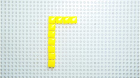 stop motion of the letter p creating one pixel at the time, made with children toys