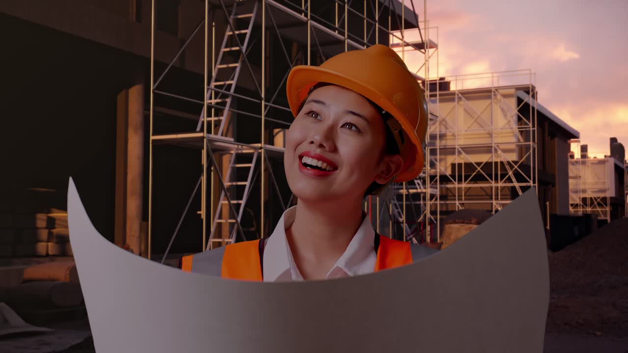 Close Up Of Asian Female Engineer With Safety Helmet Looking At Blueprint In Her Hands And Looking Around While Standing At Construction Site in Progress to New House