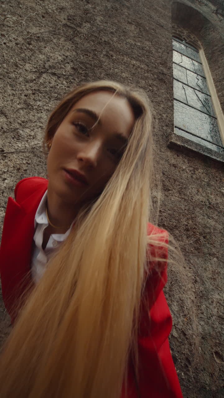 Woman in Red Suit against a Wall