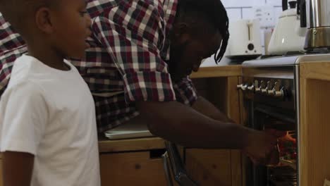 father and son cooking together