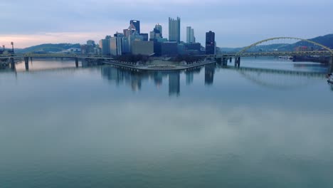 a panoramic view of point state park in pittsburgh offers a glimpse of the convergence of three rivers and the city beyond