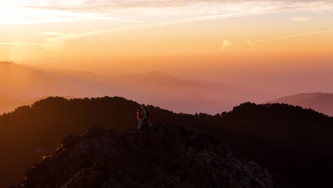 aerial drone shot showcasing the first light of dawn touching the peaks around nainital’s mountain landscape.