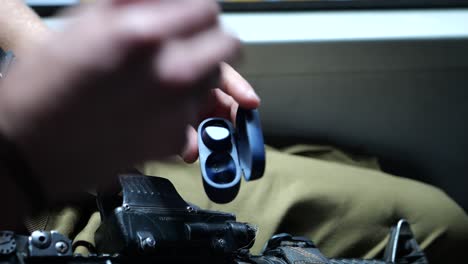 soldier taking earphones out of the box, close up