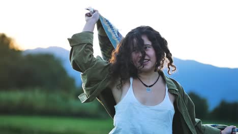 carefree woman in plaid enjoying freedom in mountains