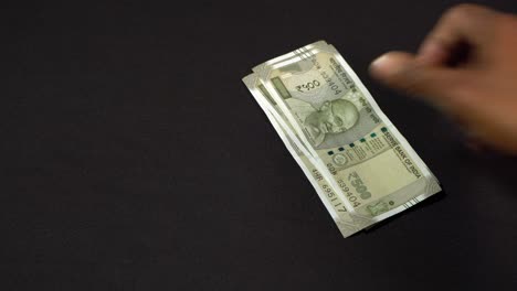 a man counting indian rupees