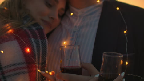 Close-up-of-a-girl-lying-on-the-chest-of-a-guy.-Strong-romantic-feelings.-Sunset-date-on-the-roof.