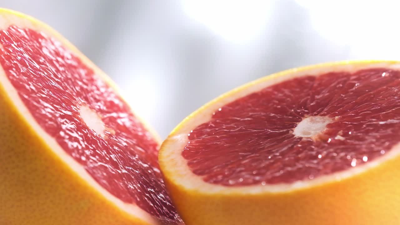 Macro shot of Sliced Grapefruit rotating in Slow motion, Vibrant colors fruit