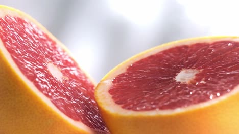 macro shot of sliced grapefruit rotating in slow motion, vibrant colors fruit