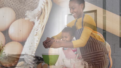 animation of happy african american mother and daughter cooking over eggs and basket