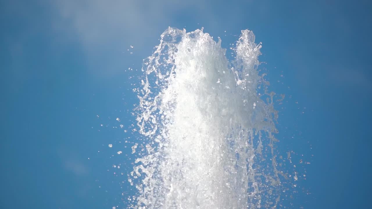 Close up shot of water fountain spelling transparent water outdoors in summer
