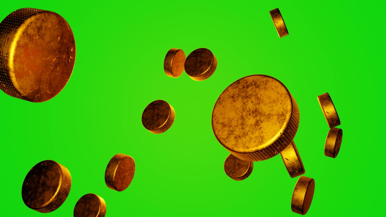 muchos pucks de hockey dorados cayendo en el fondo de chromakey.
