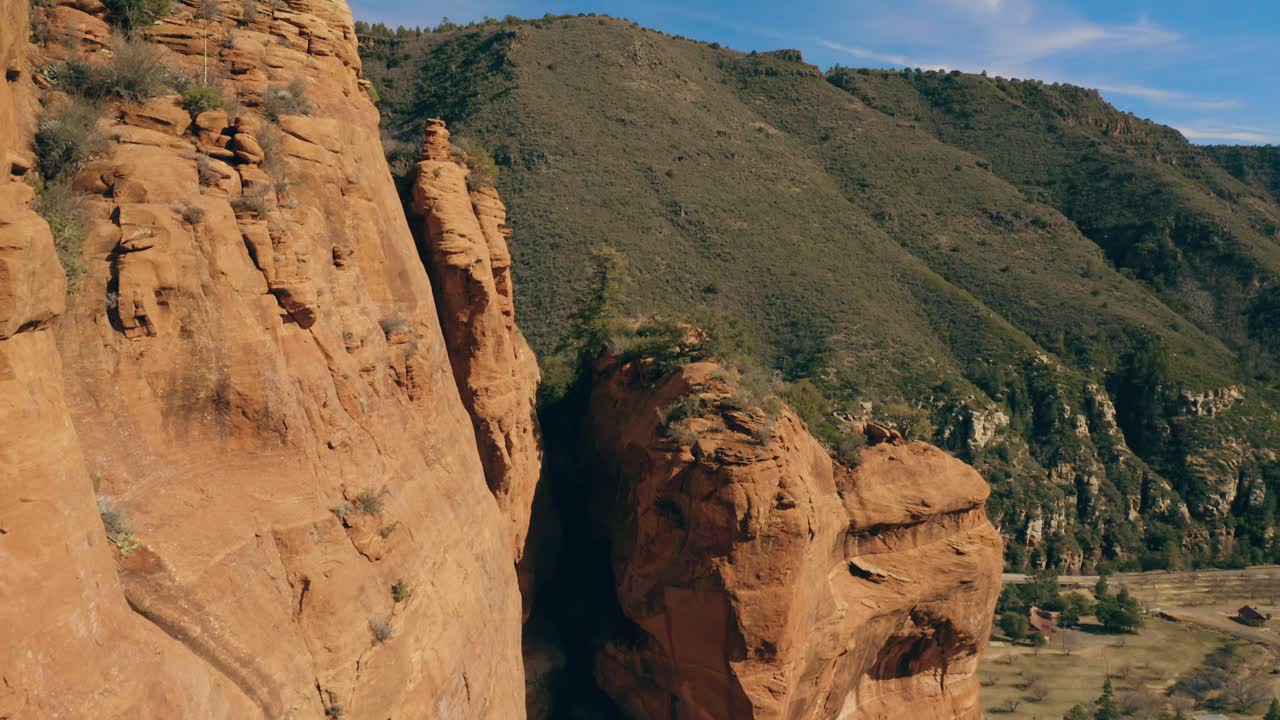 Slow panning aerial shot of massive canyon wall in Arizona. 4K footage
