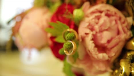 wedding rings in a floral bouquet