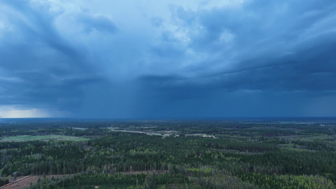 Powerful rainfall on Lithuania countryside, aerial view