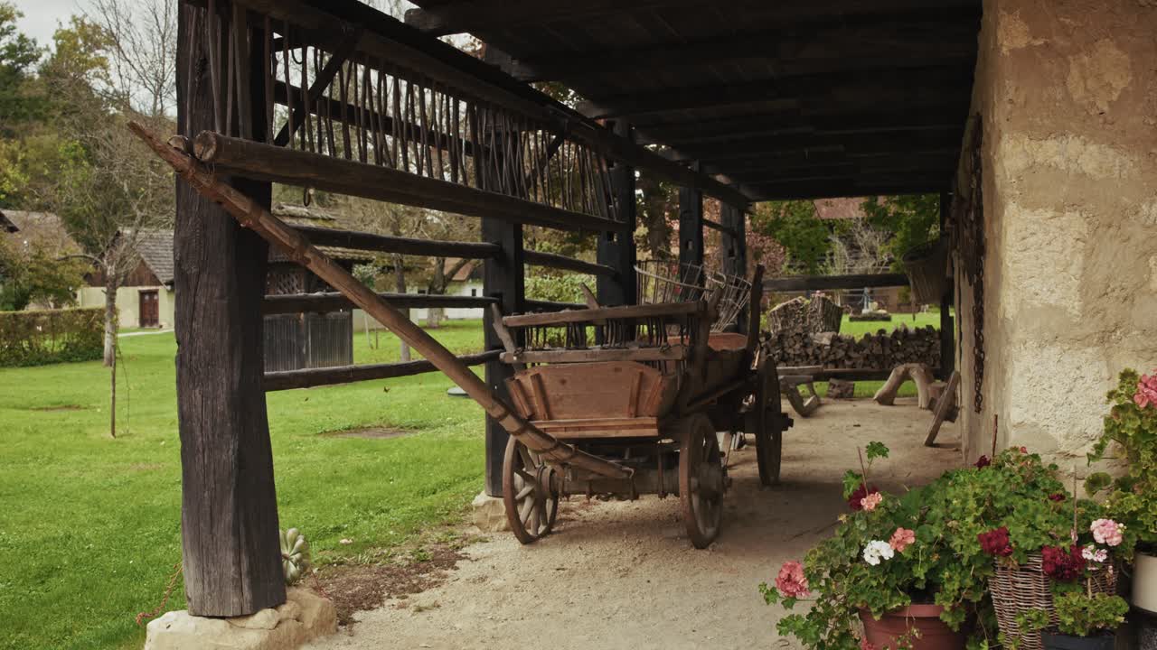 Old Wooden Cart on a Rustic Porch in a Countryside Setting