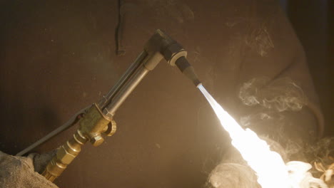 slow motion lighting a torch in a shop