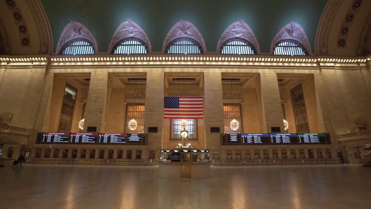 A wide-angle view of Grand Central Station in New York City empty with almost no people during the corona virus pandemic