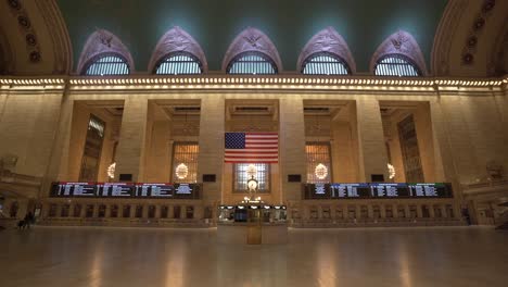 a wide-angle view of grand central station in new york city empty with almost no people during the corona virus pandemic
