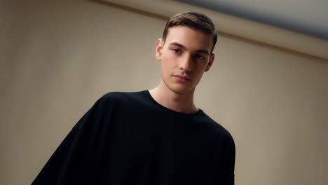 portrait of a young man in a black t-shirt