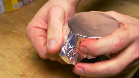 wrapping food container with aluminum foil