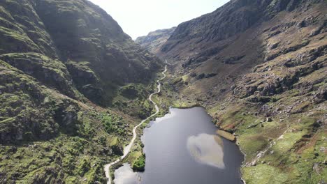 the gap of dunloe in kerry, ireland feature also the black lake and pony and carts