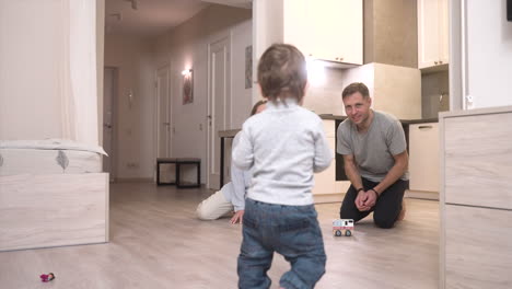 Rear-View-Of-A-Barefoot-Baby-Taking-His-First-Steps-1