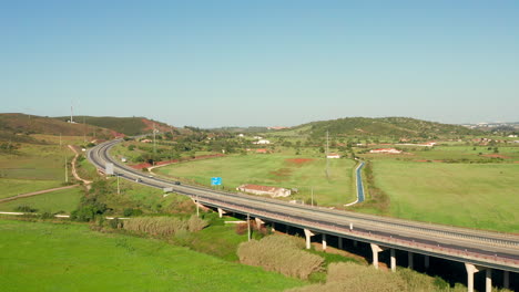 aerial: a highway going through the country side of the algarve in portugal