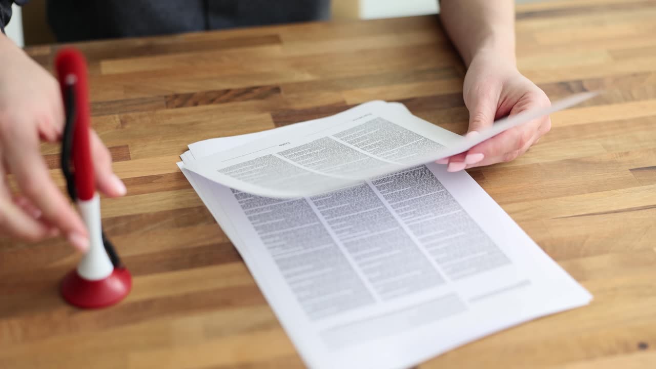 Hands Signing or Reviewing Official Documents