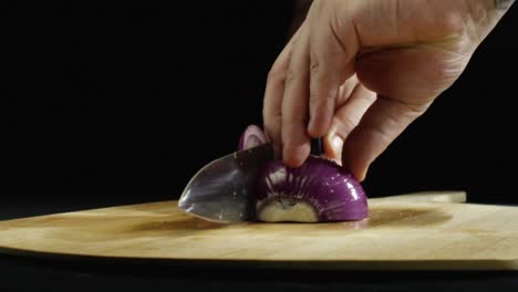 chef chopping a red onion