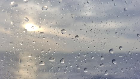 water droplets on the window glass of boat sailing through the waters of strait of gibraltar