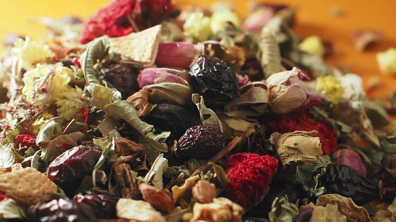 Close-up of a vibrant herbal tea blend with dried flowers and fruits