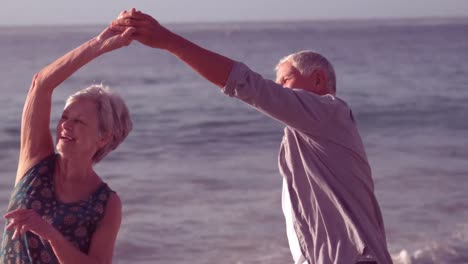 Cute-senior-couple-dancing-