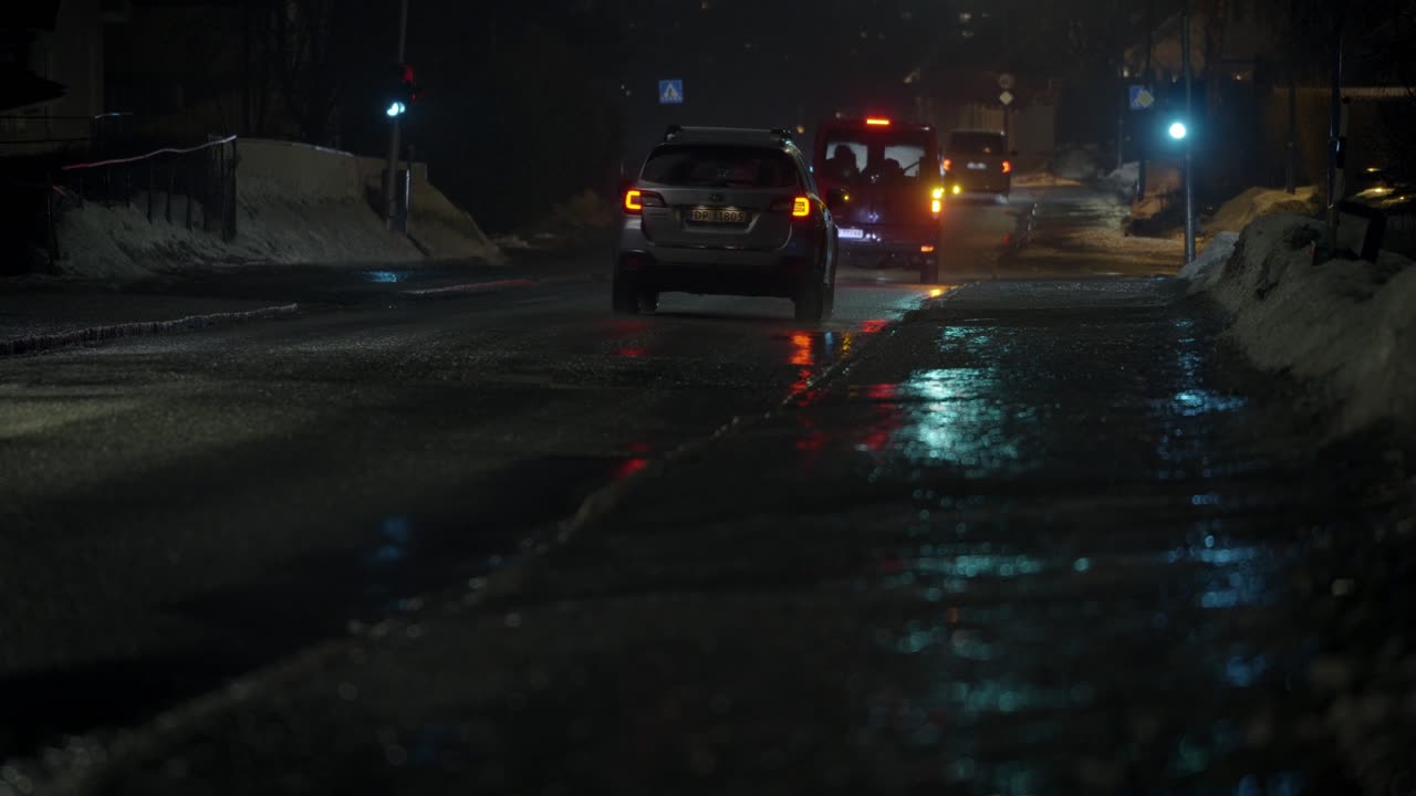 Dark and wet street traffic. Cold an hazy atmosphare.