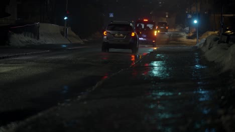dark and wet street traffic. cold an hazy atmosphare.