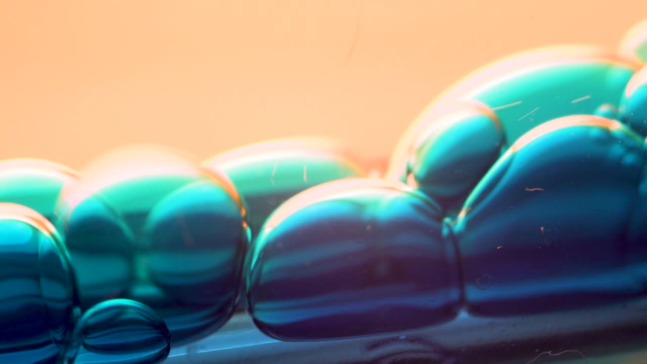 Shiny Blue Bubbles Falling Abstract Macro